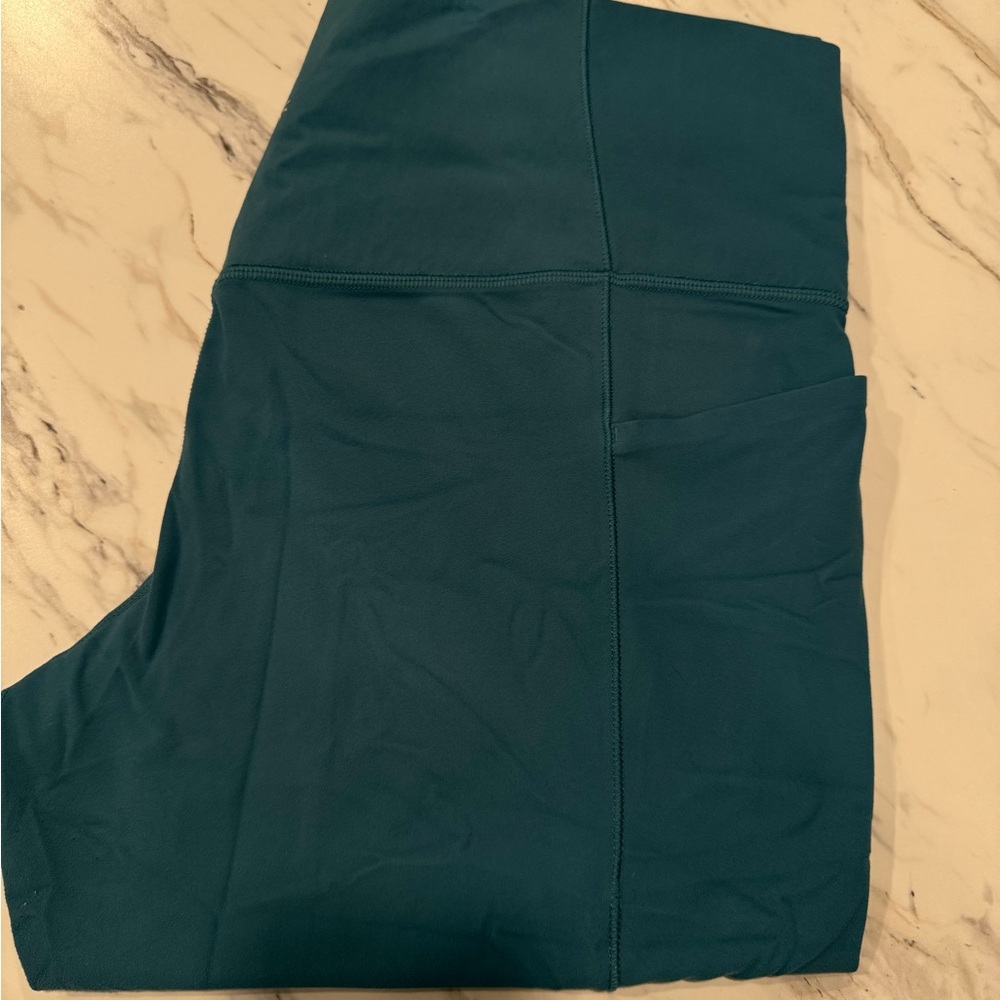 Athleta Teal Salutation Stash High Rise Capri Leggings
